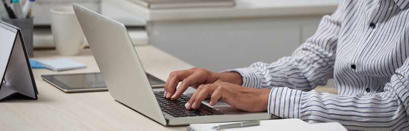 An employee working on a computer.